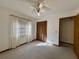 Cheerful bedroom with carpet, window, and closet at 219 Macon Way, St Cloud, FL 34769