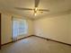 Bright bedroom featuring carpet flooring and ceiling fan at 219 Macon Way, St Cloud, FL 34769
