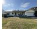 Single-story house with carport and well-maintained lawn at 219 Macon Way, St Cloud, FL 34769