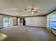 Spacious living area with carpeted floors and a ceiling fan at 219 Macon Way, St Cloud, FL 34769