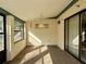 Relaxing sunroom with carpet, windows, and a ceiling fixture at 219 Macon Way, St Cloud, FL 34769