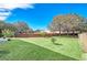 Large backyard with grassy lawn and brick wall at 223 Largovista Dr, Oakland, FL 34787