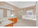Double vanity bathroom with a large soaking tub and shower at 223 Largovista Dr, Oakland, FL 34787