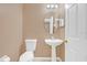 Powder room with pedestal sink and toilet at 223 Largovista Dr, Oakland, FL 34787