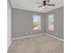 Well-lit bedroom with neutral walls and carpet at 223 Largovista Dr, Oakland, FL 34787