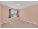 Bright bedroom with pink walls and carpeting at 223 Largovista Dr, Oakland, FL 34787
