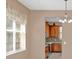 Bright dining area with window and view into the kitchen at 223 Largovista Dr, Oakland, FL 34787