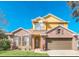 Brick two-story house with a two-car garage and landscaping at 223 Largovista Dr, Oakland, FL 34787