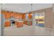 Bright kitchen featuring stainless steel appliances and light wood cabinets at 223 Largovista Dr, Oakland, FL 34787