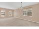 Living room with carpet, two windows, and window treatments at 223 Largovista Dr, Oakland, FL 34787