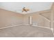 Living room with neutral walls, carpet, and ceiling fan at 223 Largovista Dr, Oakland, FL 34787