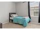 Inviting bedroom features a bed with soft blue bedding and natural light at 2276 Centerra Loop, Kissimmee, FL 34741