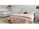 Cozy bedroom features a white crib, charming bed, and whimsical plush animal hammock at 2276 Centerra Loop, Kissimmee, FL 34741