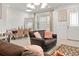Bright, open-concept living area with tile floors, modern furnishings, and natural light at 2276 Centerra Loop, Kissimmee, FL 34741