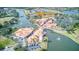 Aerial view of the Village Center in Solivita, surrounded by lakes, golf courses, and landscaped grounds at 2285 Palm Tree Dr, Kissimmee, FL 34759