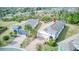 Aerial view of a home in a neighborhood with manicured lawns, lush trees, and well-maintained exteriors at 2285 Palm Tree Dr, Kissimmee, FL 34759
