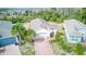 Aerial view of single-Gathering home with landscaped yard and driveway at 2285 Palm Tree Dr, Kissimmee, FL 34759