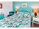 Bright bedroom featuring flamingo-themed decor and a comfortable white iron bed at 2285 Palm Tree Dr, Kissimmee, FL 34759
