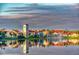 Scenic view of Solivita's architecture reflected on tranquil lake waters at 2285 Palm Tree Dr, Kissimmee, FL 34759