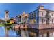 A waterfront building reflecting on the water with manicured landscaping at 2285 Palm Tree Dr, Kissimmee, FL 34759