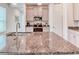 Modern kitchen featuring gray cabinets, stainless steel appliances, and a large island with granite countertops at 2285 Palm Tree Dr, Kissimmee, FL 34759