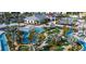 Aerial view of resort-style pool, lazy river, clubhouse, and mini golf at 2381 Reading Trl, Kissimmee, FL 34746
