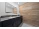 Bathroom with double vanity and wood-look tile at 2381 Reading Trl, Kissimmee, FL 34746