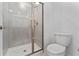 Simple bathroom with shower and white toilet at 2381 Reading Trl, Kissimmee, FL 34746