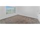 Simple bedroom with carpet and window with blinds at 2381 Reading Trl, Kissimmee, FL 34746