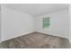 Simple bedroom with carpet flooring and a window at 2381 Reading Trl, Kissimmee, FL 34746