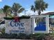 The Cove at Storey Lake community entrance sign with festive holiday decor at 2381 Reading Trl, Kissimmee, FL 34746