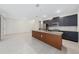 Modern kitchen with wood accent island and stainless steel appliances at 2381 Reading Trl, Kissimmee, FL 34746