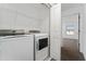 Laundry room with washer, dryer, and built-in shelving at 2381 Reading Trl, Kissimmee, FL 34746