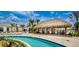 Relaxing pool area with tiki bar and lounge chairs at 2381 Reading Trl, Kissimmee, FL 34746