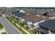 Neighborhood aerial view showcasing well-maintained townhouses with manicured lawns in a Gathering-friendly community at 2449 Varenna Loop, Kissimmee, FL 34741