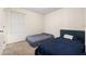 Bedroom featuring two beds, neutral walls, and a window, creating a cozy and functional space at 2449 Varenna Loop, Kissimmee, FL 34741