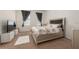 Cozy main bedroom with a large bed, soft lighting, and neutral decor at 2449 Varenna Loop, Kissimmee, FL 34741