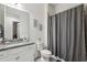 Bathroom with granite countertop, toilet and shower/tub combo at 2451 Datura Loop, St Cloud, FL 34772