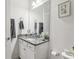 Small bathroom with granite countertop and single sink vanity at 2451 Datura Loop, St Cloud, FL 34772