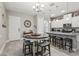 Round dining table with seating for four in the kitchen area at 2451 Datura Loop, St Cloud, FL 34772