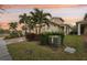 Two-story house with a two-car garage and landscaped yard at 2451 Datura Loop, St Cloud, FL 34772