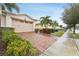 Two-story house with a two-car garage and landscaped yard at 2451 Datura Loop, St Cloud, FL 34772