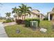 Two-story house with a two-car garage and landscaped yard at 2451 Datura Loop, St Cloud, FL 34772