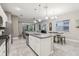 Modern kitchen with white cabinets, granite countertops and stainless steel appliances at 2451 Datura Loop, St Cloud, FL 34772