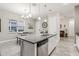 Kitchen island with granite countertop, sink, and dishwasher at 2451 Datura Loop, St Cloud, FL 34772