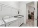 Laundry room with washer, dryer, and granite countertop at 2451 Datura Loop, St Cloud, FL 34772