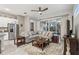 Spacious living room with comfortable sectional sofa and access to patio at 2451 Datura Loop, St Cloud, FL 34772
