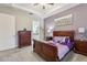 Main bedroom with a sleigh bed and a dresser at 2451 Datura Loop, St Cloud, FL 34772