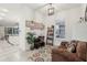 Bright home office with built-in shelving and view into kitchen at 2451 Datura Loop, St Cloud, FL 34772