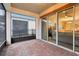 Relaxing screened patio with brick flooring and access to backyard at 2451 Datura Loop, St Cloud, FL 34772